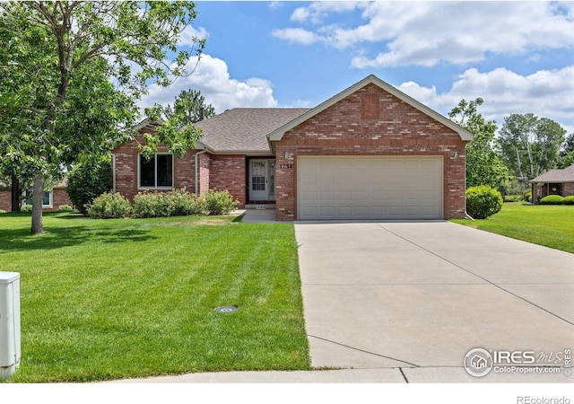 1754 45th Ave, Greeley, CO 80634 - single story home with a front lawn, concrete driveway, a garage, brick siding, and a shingled roof