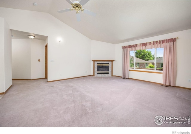 1754 45th Ave, Greeley, CO 80634 - unfurnished living room with lofted ceiling, carpet floors, a tile fireplace, and ceiling fan