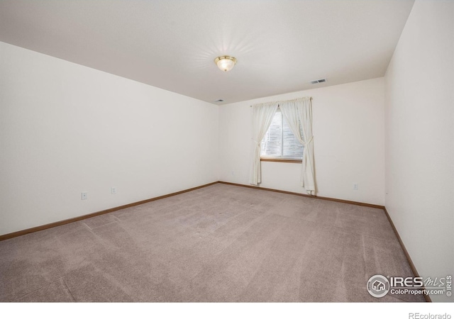 1754 45th Ave, Greeley, CO 80634 - carpeted empty room with baseboards