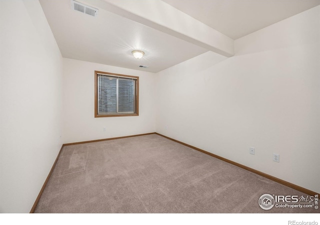1754 45th Ave, Greeley, CO 80634 - carpeted empty room featuring baseboards and beamed ceiling