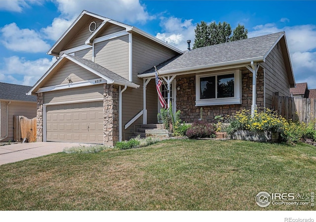 6019 S Pierson Ct, Littleton, CO 80127 - tri-level home with stone siding, concrete driveway, and roof with shingles