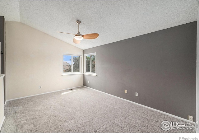 6019 S Pierson Ct, Littleton, CO 80127 - spare room with vaulted ceiling, ceiling fan, carpet, and a textured ceiling