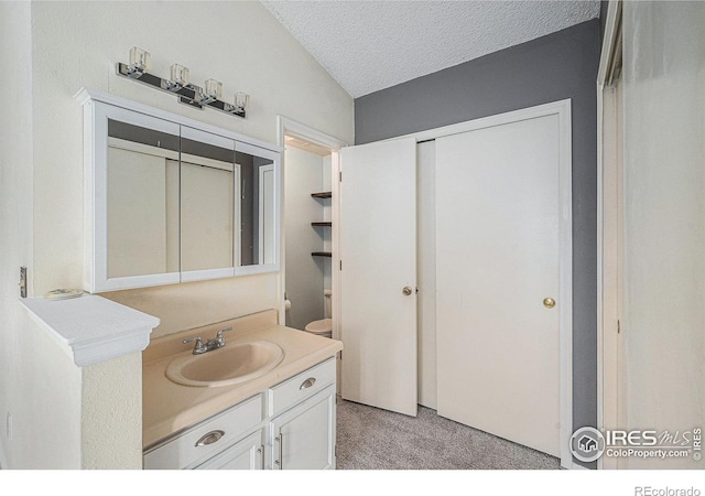 6019 S Pierson Ct, Littleton, CO 80127 - bathroom with vanity and a textured ceiling