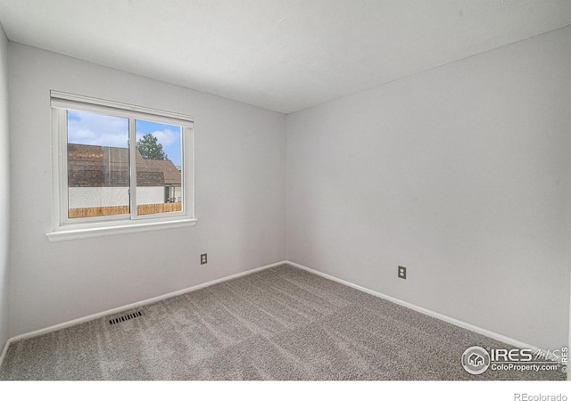 6019 S Pierson Ct, Littleton, CO 80127 - carpeted empty room featuring baseboards