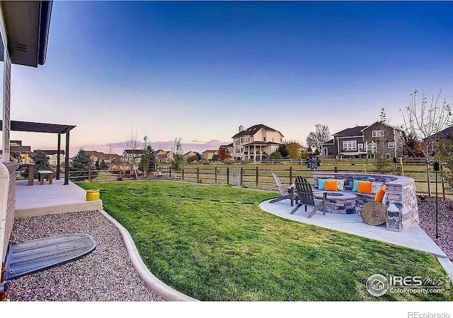 8541 Allenbrook Dr, Windsor, CO 80550 - yard at dusk with a patio area and a fire pit