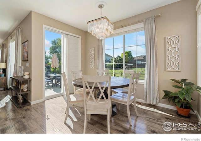 8541 Allenbrook Dr, Windsor, CO 80550 - dining space with wood finished floors and a chandelier