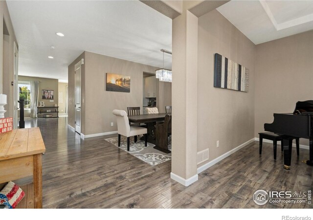 8541 Allenbrook Dr, Windsor, CO 80550 - office featuring dark wood-style flooring, a chandelier, and recessed lighting