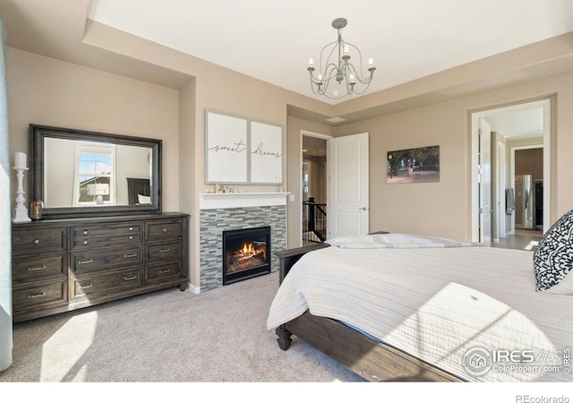 8541 Allenbrook Dr, Windsor, CO 80550 - bedroom featuring a chandelier, carpet, and a tiled fireplace