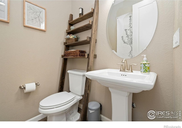 8541 Allenbrook Dr, Windsor, CO 80550 - bathroom featuring toilet and baseboards