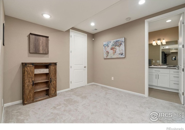 8541 Allenbrook Dr, Windsor, CO 80550 - unfurnished bedroom featuring carpet flooring, recessed lighting, and connected bathroom