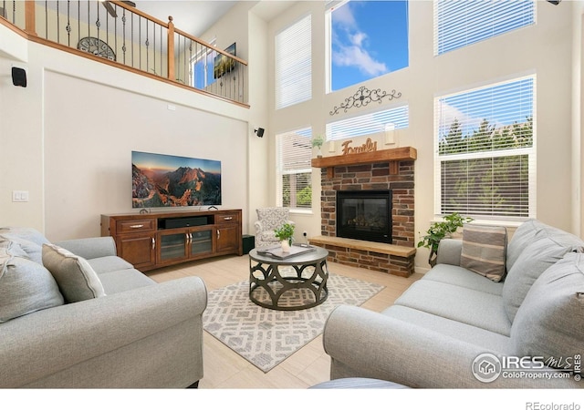 5355 Brookline Dr, Timnath, CO 80547 - living area with a towering ceiling and a brick fireplace