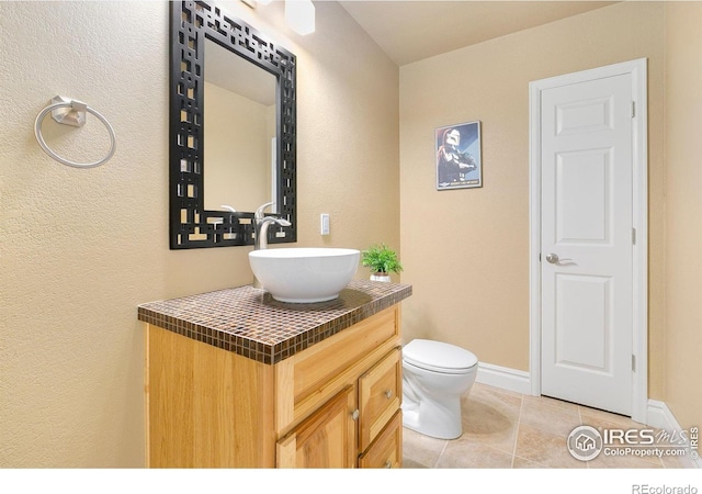 5355 Brookline Dr, Timnath, CO 80547 - bathroom featuring vanity, tile patterned floors, and a textured wall