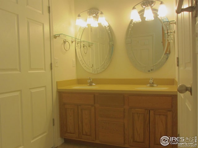 1900 68th Ave Unit 701, Greeley, CO 80634 - bathroom with double vanity and a chandelier