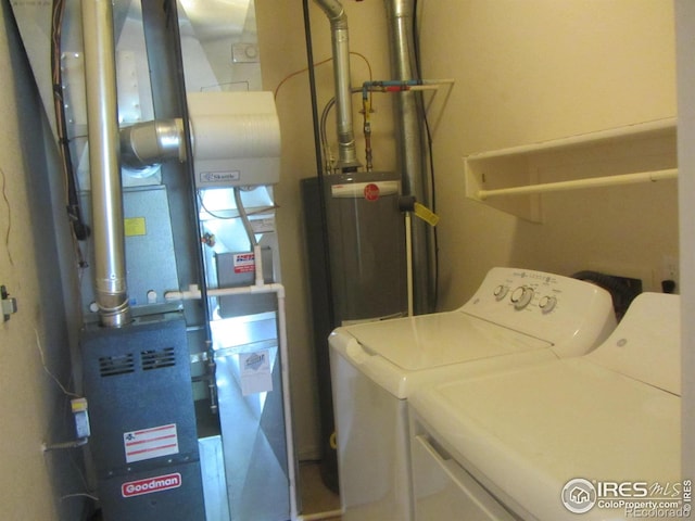 1900 68th Ave Unit 701, Greeley, CO 80634 - washroom featuring washing machine and clothes dryer, water heater, and heating unit