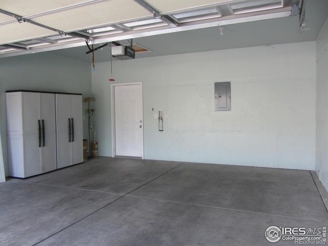 1900 68th Ave Unit 701, Greeley, CO 80634 - garage featuring electric panel and a garage door opener