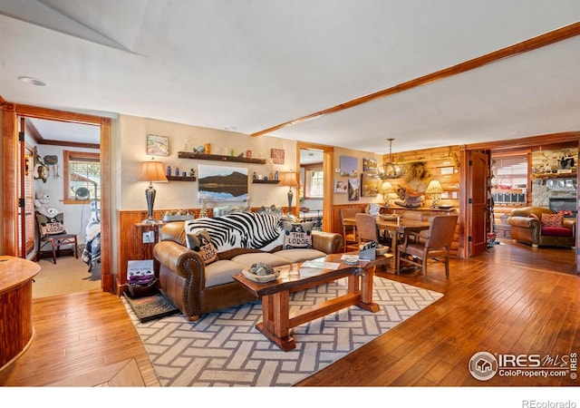2238 Eagle Cliff Rd, Estes Park, CO 80517 - living room with hardwood / wood-style floors, wainscoting, and wood walls