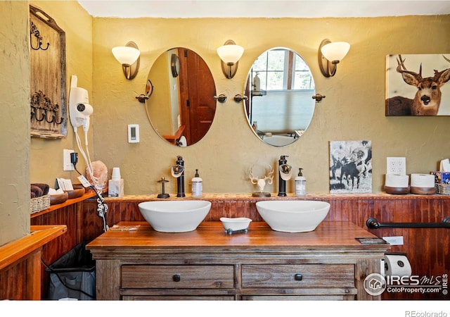2238 Eagle Cliff Rd, Estes Park, CO 80517 - bathroom with double vanity and a textured wall