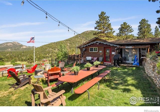 2238 Eagle Cliff Rd, Estes Park, CO 80517 - view of green lawn featuring a mountain view and french doors