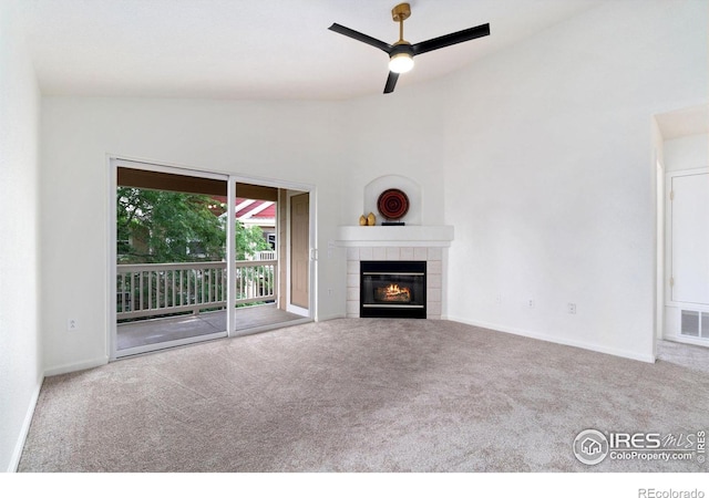 3350 Boulder Cir Unit 201, Broomfield, CO 80023 - unfurnished living room featuring carpet floors, lofted ceiling, a fireplace, and ceiling fan
