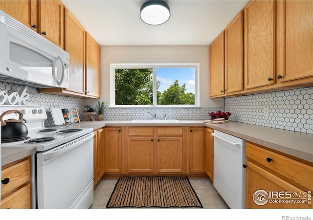 3350 Boulder Cir Unit 201, Broomfield, CO 80023 - kitchen featuring white appliances, light tile patterned floors, light countertops, and backsplash