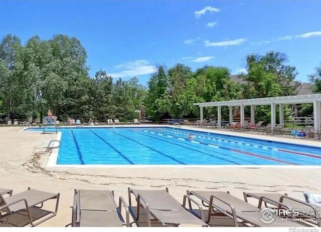 3350 Boulder Cir Unit 201, Broomfield, CO 80023 - community pool with view of scattered trees and a patio