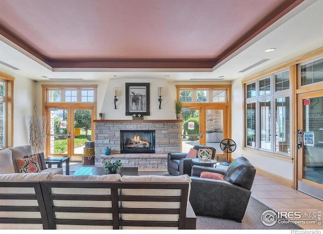 3350 Boulder Cir Unit 201, Broomfield, CO 80023 - tiled living area with a raised ceiling and a stone fireplace