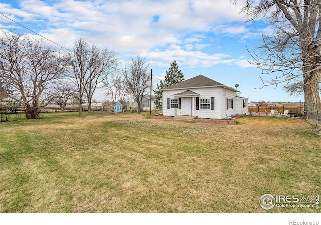 2118 N 47th Ave, Greeley, CO 80631 - fenced backyard featuring a storage unit