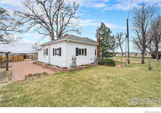 2118 N 47th Ave, Greeley, CO 80631 - view of home's exterior with a chimney and a patio