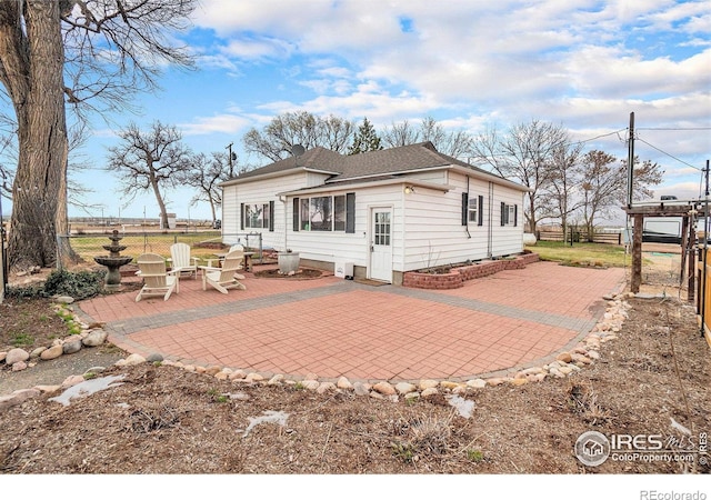 2118 N 47th Ave, Greeley, CO 80631 - back of property with a patio area and a fenced backyard