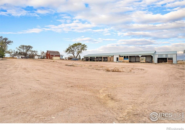 2118 N 47th Ave, Greeley, CO 80631 - view of yard featuring an outbuilding and a detached carport