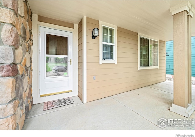 502 Peregrine Cir, Longmont, CO 80504 - entrance to property featuring a porch