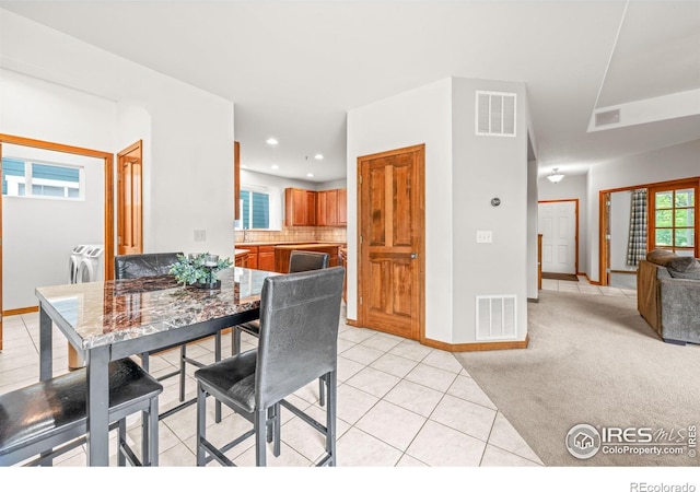 502 Peregrine Cir, Longmont, CO 80504 - dining space with light tile patterned flooring, light carpet, and recessed lighting