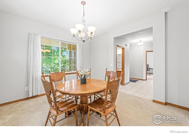 502 Peregrine Cir, Longmont, CO 80504 - dining area with light carpet and a chandelier