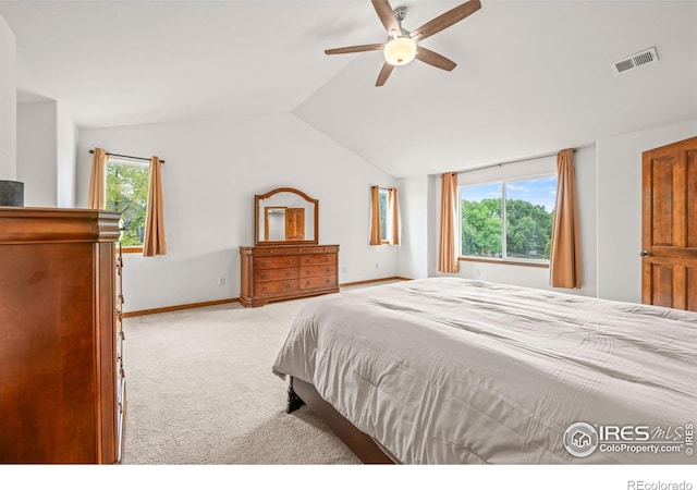 502 Peregrine Cir, Longmont, CO 80504 - carpeted bedroom with vaulted ceiling and a ceiling fan