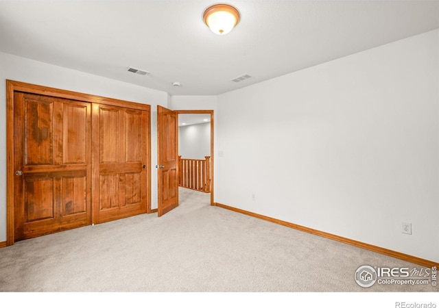 502 Peregrine Cir, Longmont, CO 80504 - unfurnished bedroom with light carpet and a closet