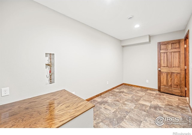 502 Peregrine Cir, Longmont, CO 80504 - empty room featuring stone finish floors and recessed lighting