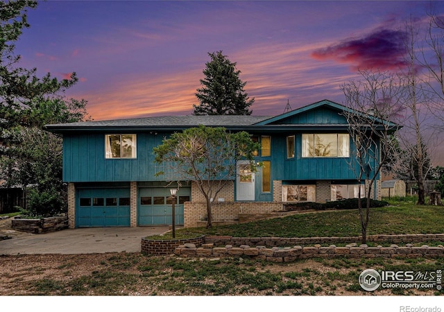 37416 County Road 45, Eaton, CO 80615 - split foyer home with brick siding, an attached garage, concrete driveway, and a front yard