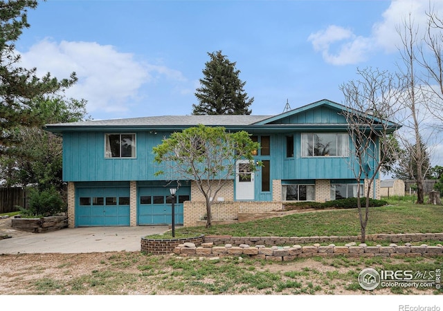 37416 County Road 45, Eaton, CO 80615 - raised ranch featuring an attached garage, brick siding, and driveway