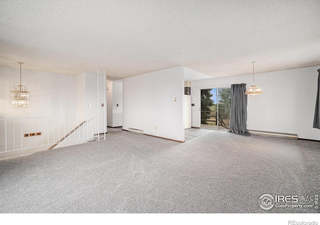 37416 County Road 45, Eaton, CO 80615 - carpeted spare room with a chandelier, baseboard heating, and a textured ceiling