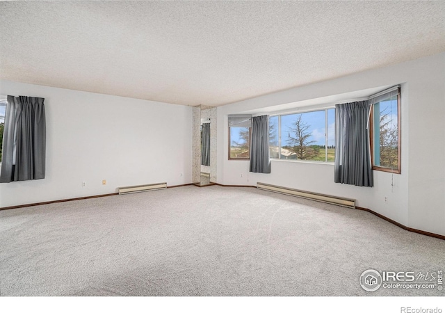 37416 County Road 45, Eaton, CO 80615 - carpeted spare room with baseboard heating, a baseboard heating unit, and a textured ceiling