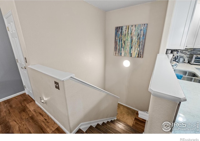 1703 Whitehall Dr Unit G, Longmont, CO 80504 - staircase featuring wood finished floors and baseboards