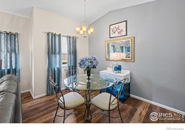 1703 Whitehall Dr Unit G, Longmont, CO 80504 - dining area featuring a chandelier, wood finished floors, and vaulted ceiling