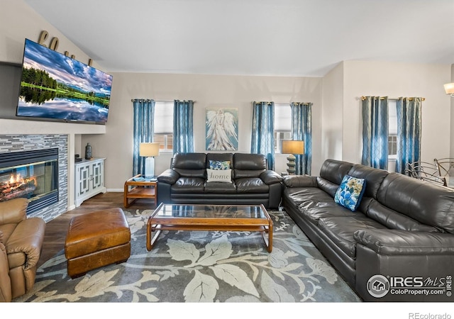 1703 Whitehall Dr Unit G, Longmont, CO 80504 - living area featuring wood finished floors and a stone fireplace