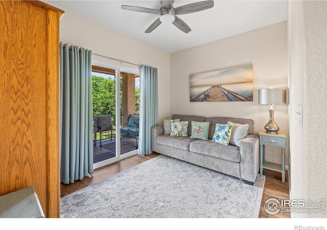 1703 Whitehall Dr Unit G, Longmont, CO 80504 - living area with wood finished floors and ceiling fan