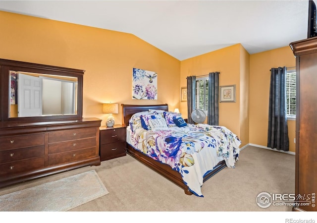1703 Whitehall Dr Unit G, Longmont, CO 80504 - bedroom featuring carpet flooring and vaulted ceiling