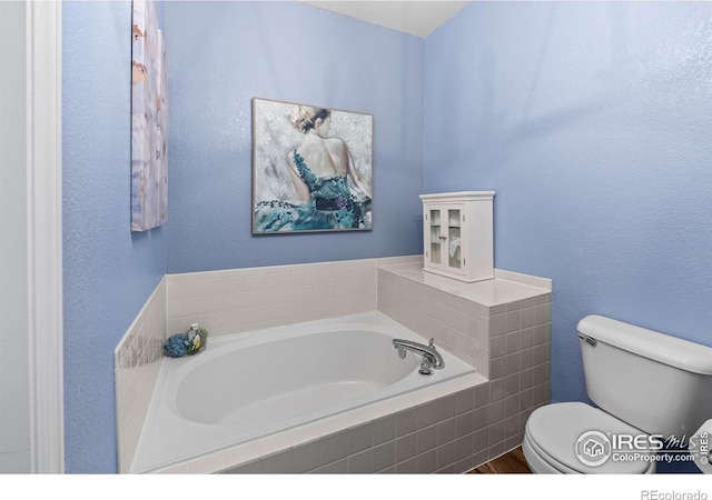 1703 Whitehall Dr Unit G, Longmont, CO 80504 - bathroom featuring a bath and toilet