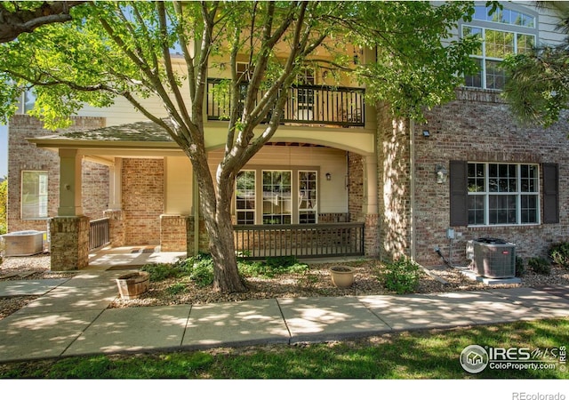 4672 W 20th Street Rd Unit 1311, Greeley, CO 80634 - view of front of property with a balcony and brick siding