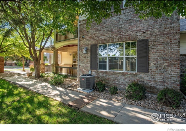4672 W 20th Street Rd Unit 1311, Greeley, CO 80634 - view of front of home featuring a balcony, covered porch, and brick siding