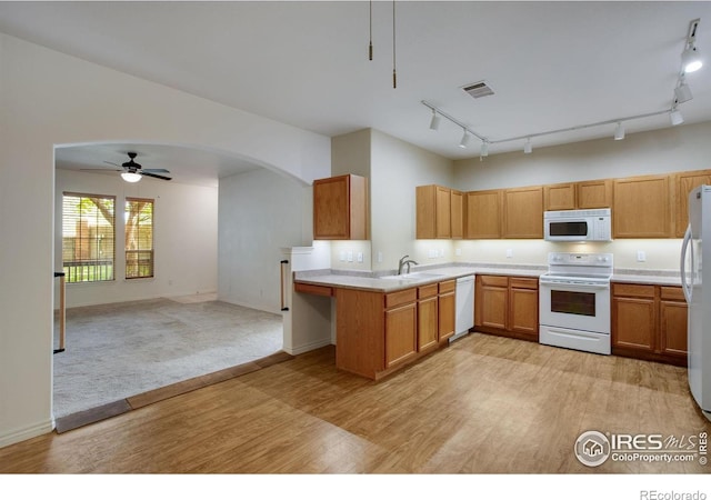 4672 W 20th Street Rd Unit 1311, Greeley, CO 80634 - kitchen with white appliances, track lighting, light wood-style flooring, and open floor plan