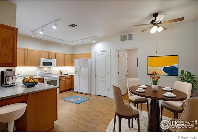 4672 W 20th Street Rd Unit 1311, Greeley, CO 80634 - kitchen with white appliances, light wood-style floors, ceiling fan, and track lighting